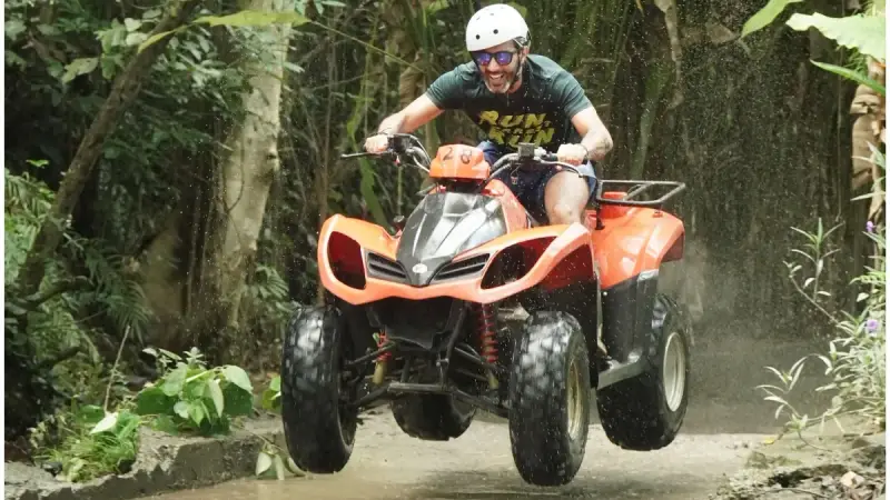 Muddy ATV trail in jungle