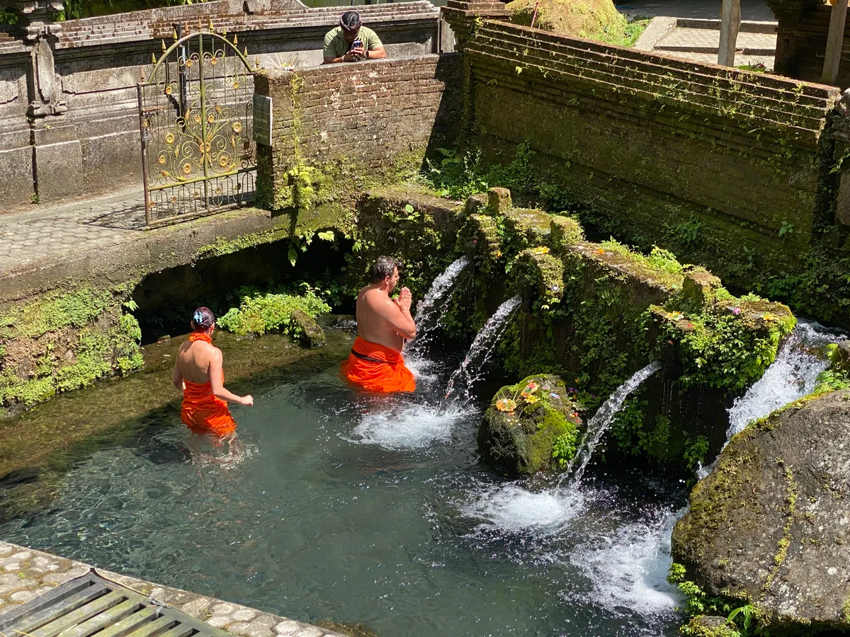 Participant setting intention at a sacred water source
