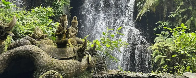 Emotional release beneath a sacred Balinese waterfall